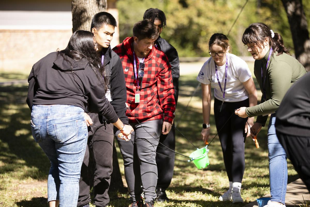 students with bucket at leadership camp